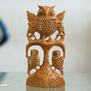Carved wooden owl sculpture with details