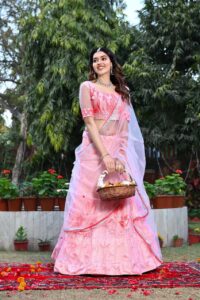 Woman in pink traditional attire.
